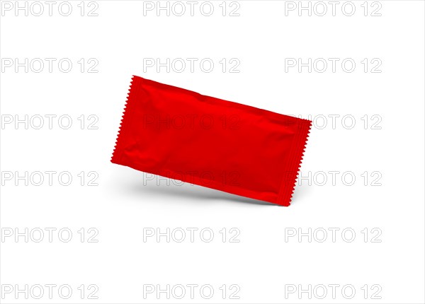 Blank red condiment packet floating isolated on white background