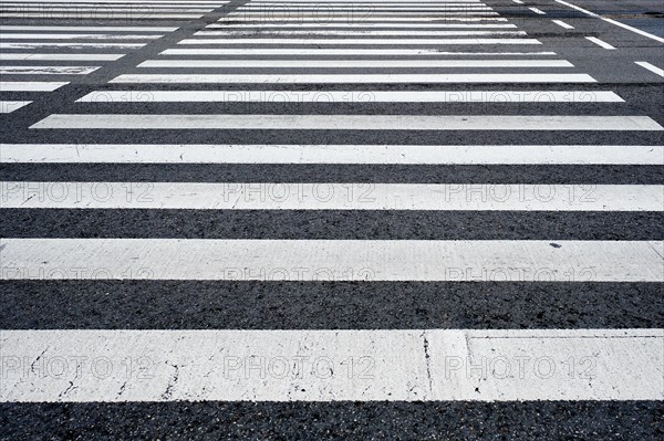 Crosswalk pedestrian crossing on asphalt road in the street