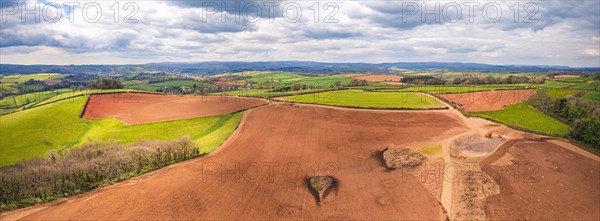 Panorama over Fields and Meadows over English Village