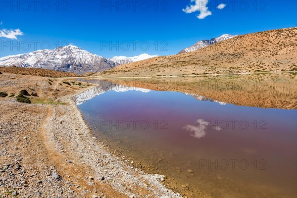 Himalayas mountains refelcting in mountain lake Dhankar Lake