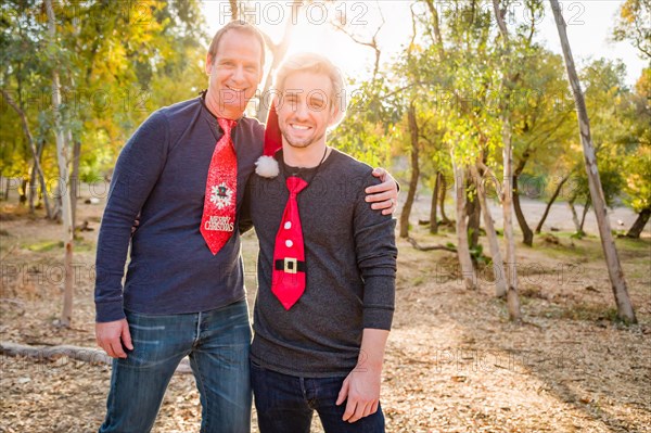 Handsome festive father and son portrait outdoors