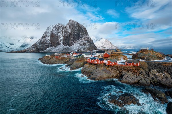 Hamnoy fishing village with red rorbu houses in Norwegian fjord in winter. Lofoten Islands