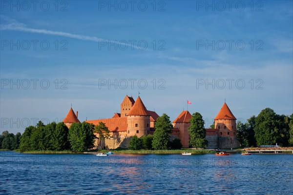 Trakai Island Castle in lake Galve with boats and yachts in summer day with beautiful sky