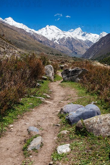 Old trade route in Himalaya surrounded with stones to Tibet from Chitkul village from Sangla Valley