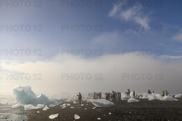 Ice and tourists on the beach