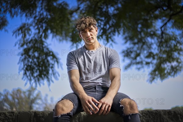 Confident young blonde man portrait