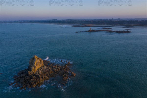 Aerial view of rock formations in the sea in front of the sandy beach Ker Emma shortly in front of sunset