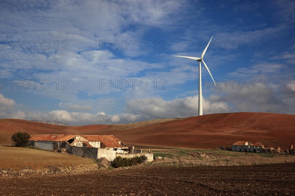 Windmill and abandoned houses in front of it