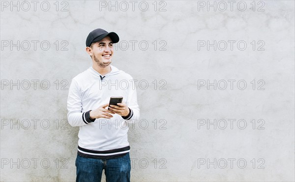 Handsome guy happy with his cell phone