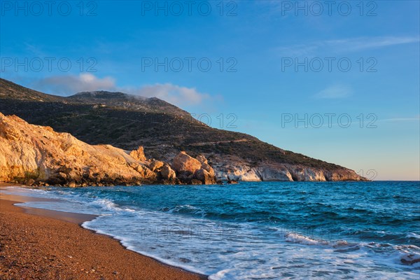 Agios Ioannis greek beach and Aegean sea on sunset