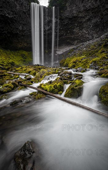 Waterfall cascading over rocky outcrop