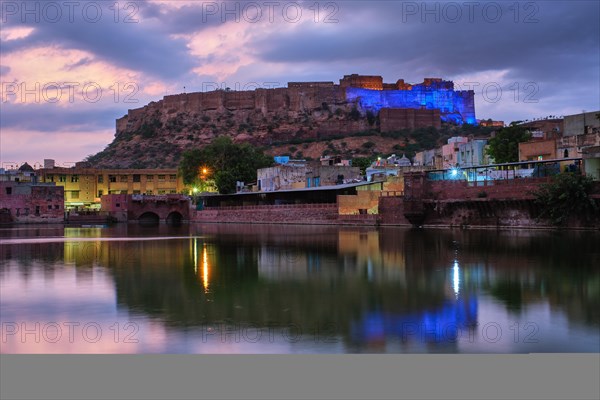 Famous indian tourist landmark Mehrangarh fort in the evening view over Gulab Sagar lake