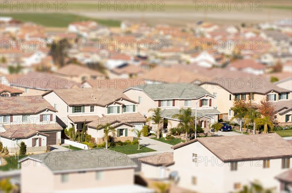 Aerial view of populated neigborhood of houses with tilt-shift blur