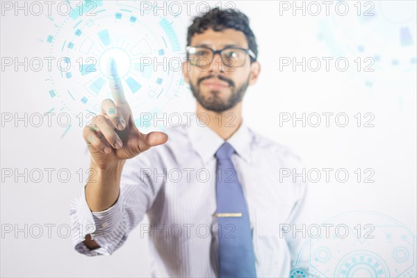 Businessman touching holographic icons