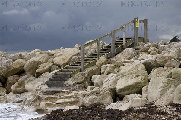 Steps over coast protection breakwater