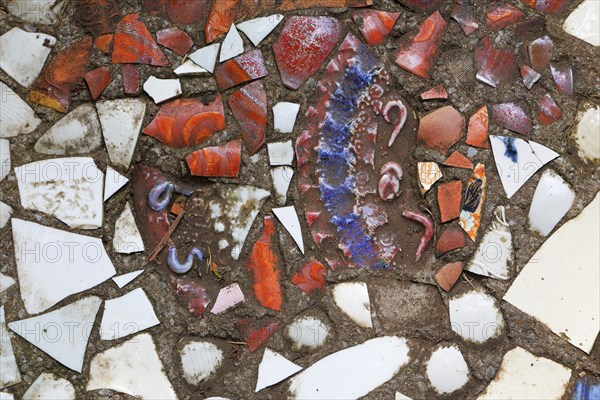 Walkway paved with broken pottery