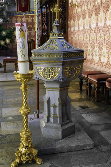 Baptismal font with candle