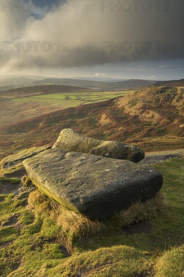 View from Gritstone rocks onto moorland habitat in the evening sun