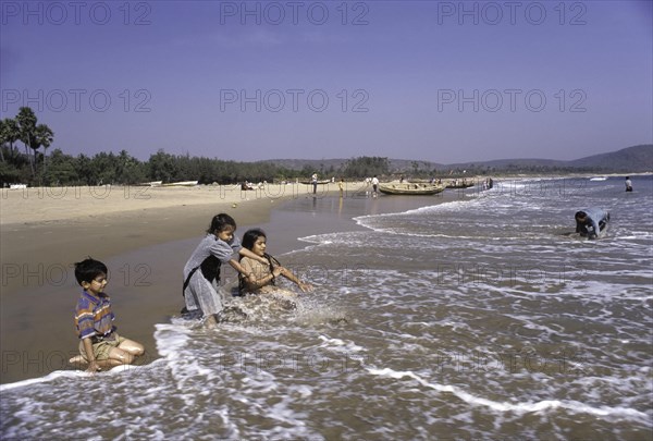 Children playing in Rishikonda beach in Visakhapatnam