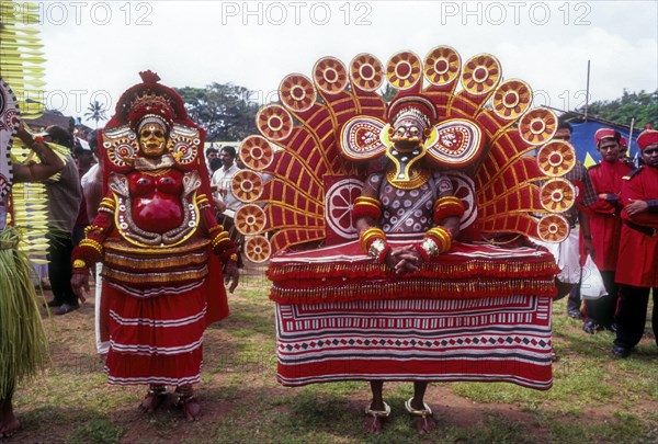 Theyyam dancers in Kavadiyattam in Athachamayam celebration in Thripunithura during Onam near Ernakulam
