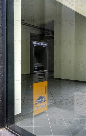 Euronet ATM on Kurfuerstendamm reflected in a shop window