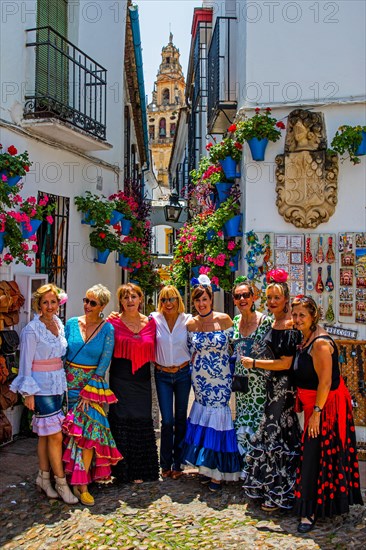 Women in flamenco costumes at the folk festival