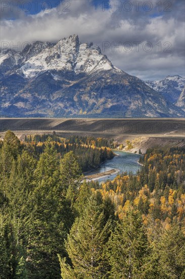 View of mountain range and forested river valley