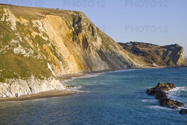Coastal view with chalk cliffs and other rock formations