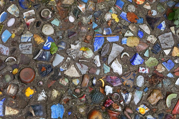 Walkway paved with broken pottery