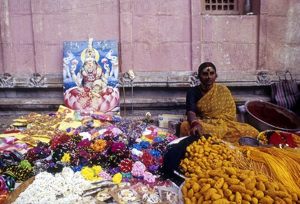 Woman selling religious offerings in Palani temple premises