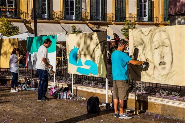 Plaza de la Merced with street painters and the birthplace of Pablo Picasso on the north-western side