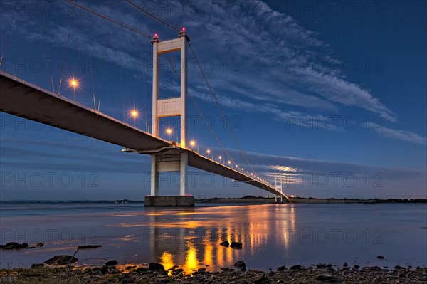 View of road bridge and rising full moon