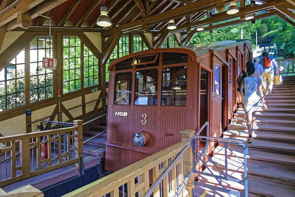 Passengers boarding carriages in upper mountain railway in Molkenkur station