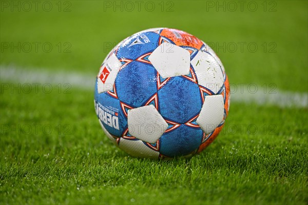 Match ball adidas Derbystar lies on grass