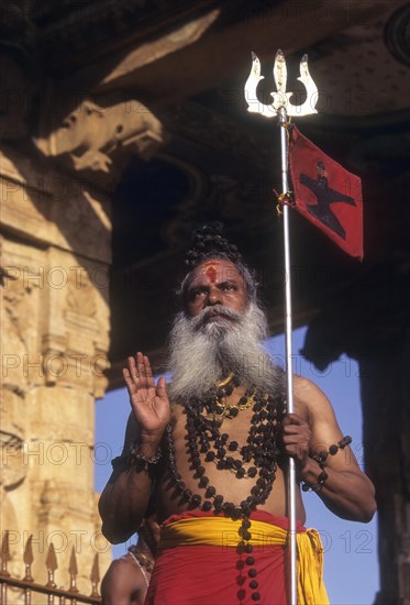 A sadhu standing on the floor of Nandi mandap in Brihadeeswarar Temple