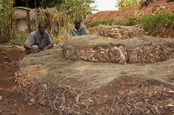 Farmer and local development worker building a keyhole vegetable garden