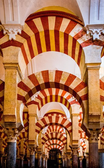 Forest of columns with alternating use of brick and stone and red and white paint