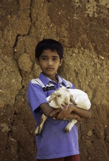 A boy with lamb