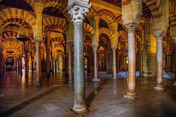Forest of columns with alternating use of brick and stone and red and white paint