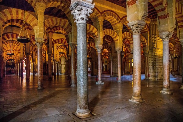 Forest of columns with alternating use of brick and stone and red and white paint