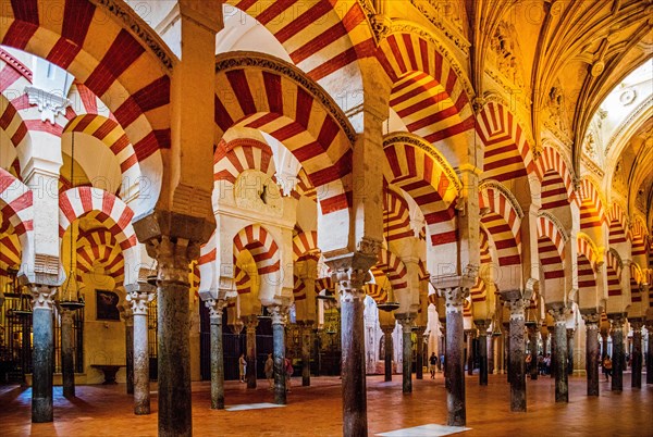 Forest of columns with alternating use of brick and stone and red and white paint