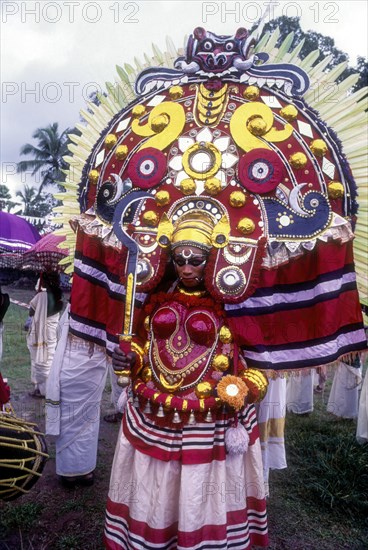 Theyyam dancer in Kavadiyattam in Athachamayam celebration in Thripunithura during Onam near Ernakulam