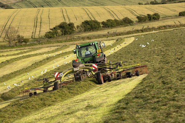 John Deere tractor with tedder