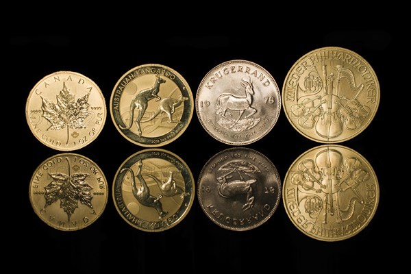 Four mirrored gold coins