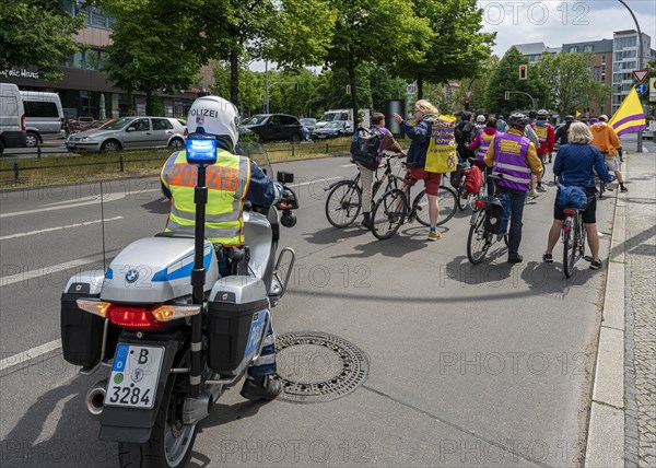 Berlin police escorting a bicycle parade on Kurfuerstendamm