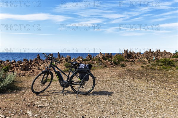 E-bike on rocky coast