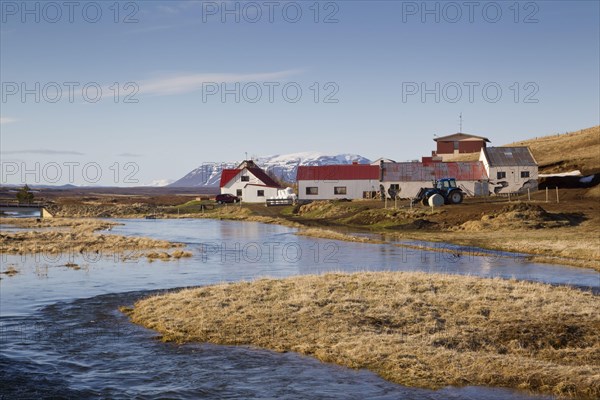 View of river and farm buildings