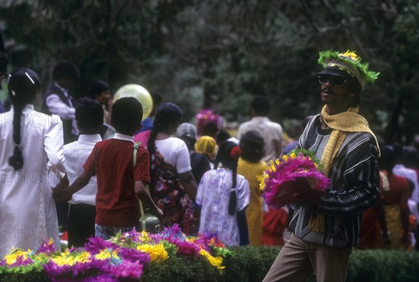 Colourful hat seller at Sim's park