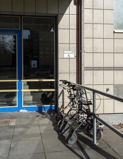 Rollator in front of the entrance to an apartment building in Berlin Mitte