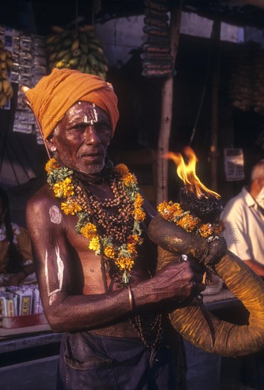 Fulfilling vow at Karamadai near Coimbatore